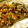 Камбала, запеченная с кедровыми орешками и изюмом